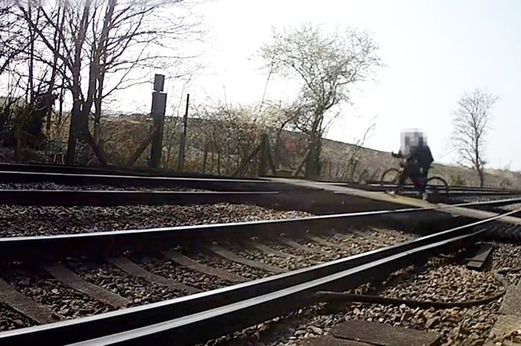**Embargoed until 00.01 GMT / Wednesday 30 April 2025**     

A cyclist & pedestrian cross the tracks, just seconds before a train approaches. Shocking CCTV footage captures the danger of pedestrian distractions at level crossings.  Release date - April 29, 2025.  The montage footage highlights the potential risks of losing focus near a railway line, from a teenager stood in the middle of a level crossing gazing at their mobile phone, to a pram-pushing couple failing to observe safety barrier alarms.  In a world full of distractions, Network Rail is warning of the more serious consequences of being distracted at level crossings. Over the past four years**, there have been 1,574 recorded near miss incidents involving pedestrians at level crossings.  Over that same period, incidents have increased on average by 16% from April to May.   