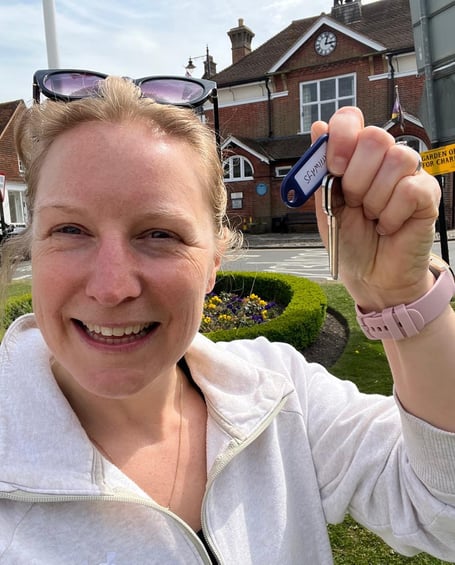 Victoria Page, director of Love Haslemere Hate Waste, picks up the keys to the fridge’s new home at Pathways Pavilion