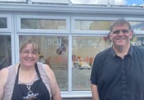 Community rallies round cafe owners after vandal attack