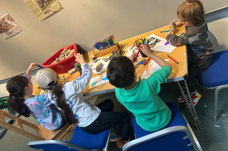 Hippo hooray! Young artists get stuck into The Herds project, creating a colourful waterhole display with puppets galore