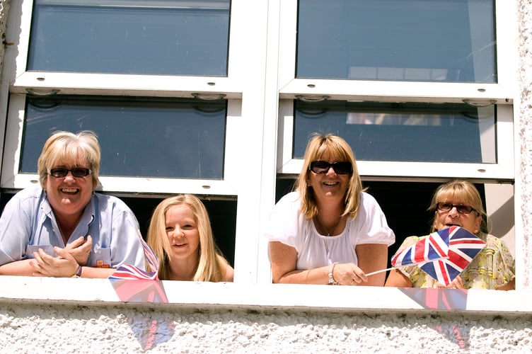 Bordon Photo Assignment, Camp Road, Bordon, Farewell to the Garrison festival, group of women watching the ceremony from their upstairs window © Paul Doyle 27.06.2015. Please credit PAUL DOYLE.