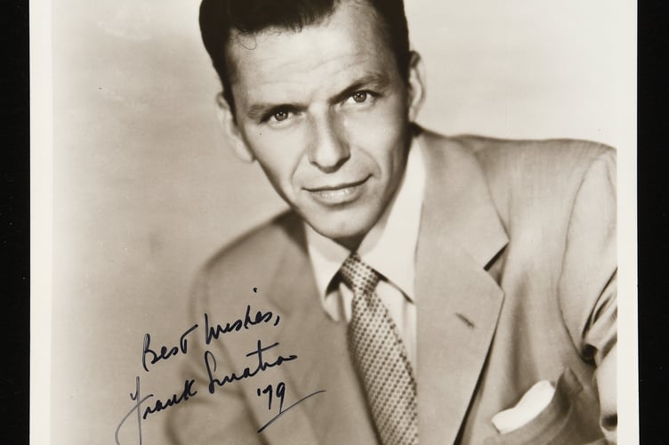 An autographed picture of Frank Sinatra.