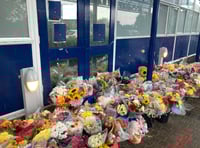 Flowers laid outside school as two students die on same day