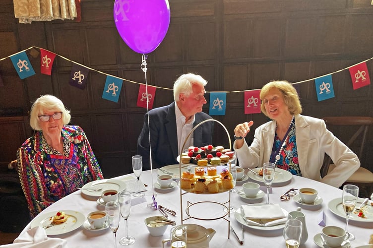 Charles Harris with his wife Marilyn (left) and TASG Chair, Jackie Bearman