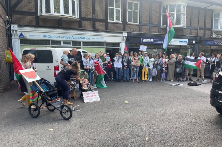 Protesters gathered outside the Hindhead offices of MPs Jeremy Hunt and Greg Stafford, demanding urgent action on Gaza.