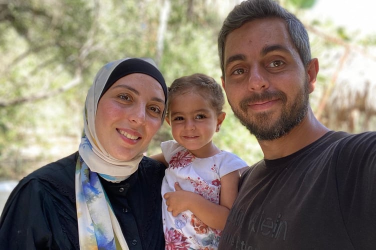 Saeed Ashi and his wife Raghda and their daughter Maryam