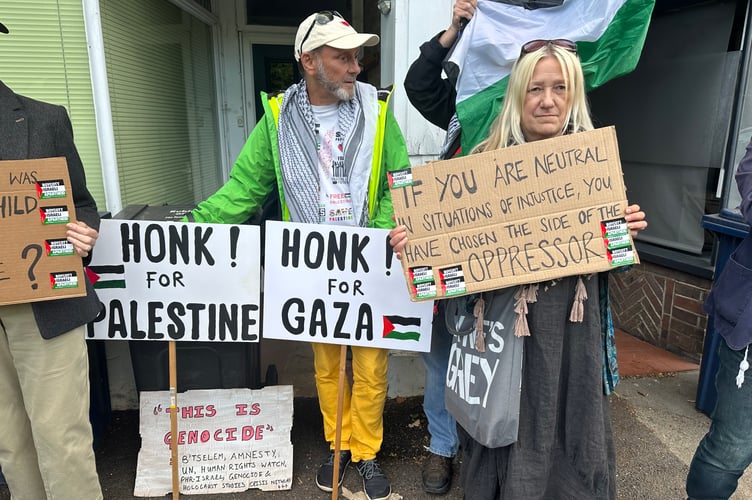 Protesters gathered outside the Hindhead offices of MPs Jeremy Hunt and Greg Stafford, demanding urgent action on Gaza