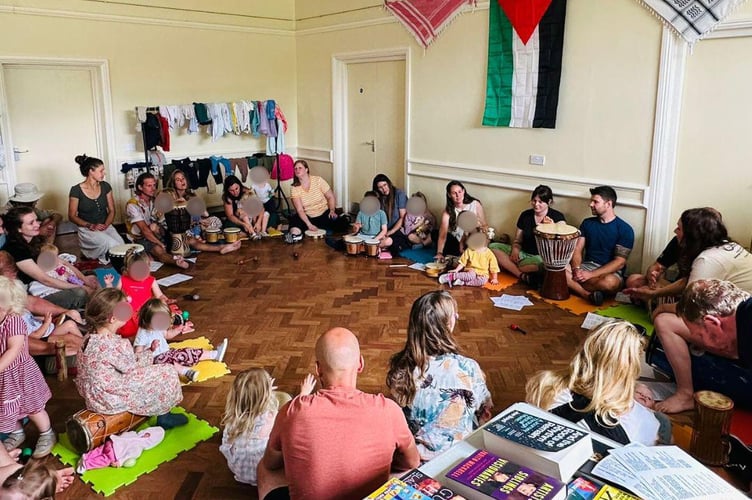 Shirley Stump with volunteers and supporters at Milland Village Hall, where the community raised £2,700 for children affected by the Gaza crisis.