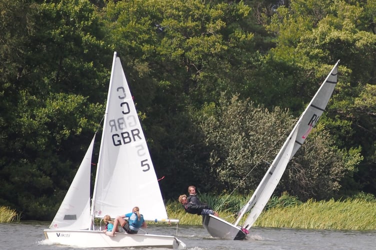 Making waves for charity: Sailors take on the 10-hour challenge at Frensham Pond to support MND research