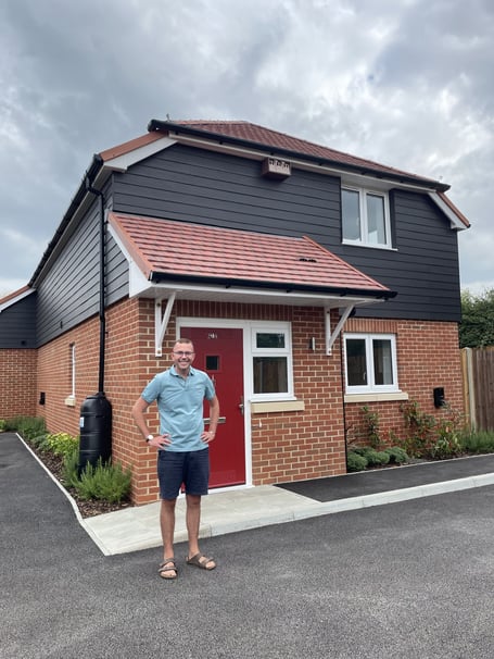 Cllr Dave Busby at Chiddingfold's first new council homes in years, with two families set to move into the initial properties at Turners Mead