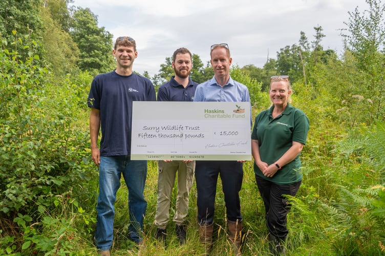 Surrey Wildlife Trust cheque presentation, from left, Will Kelsey, Charlie Thefaut, Jamie Haskins and Mandy Glass.