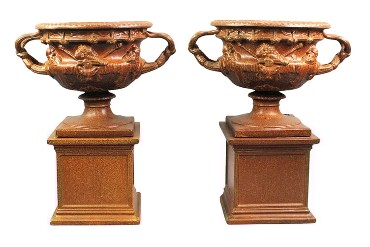 A pair of 19th century salt-glazed pottery models of the Warwick vase.