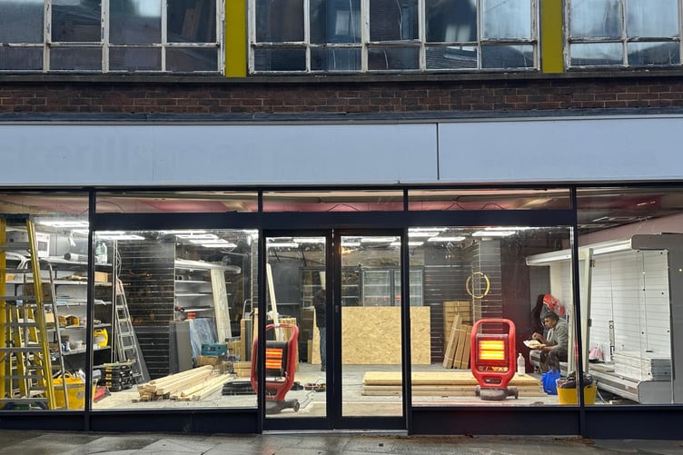 The replaced shop window for Haslemere Convenience Store.