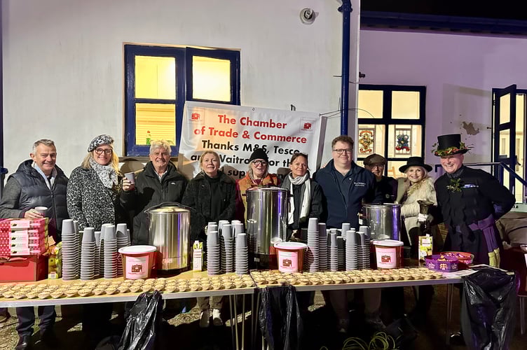 Members of the Haslemere Chamber of Trade and Commerce serve mulled wine and mince pies, helping raise £1,180 for the town’s Christmas lights and the Mayor’s Charities.