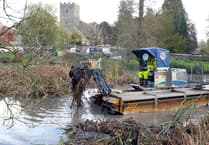 Water change in Buriton as buoyant bulldozer is pond's scooper trooper