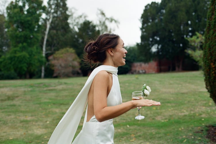 Teresa Boardman, on her wedding day. // A bride who loves the rush of a getting a good deal has bought four wedding dresses for her nuptials, all for under £1k. Teresa Boardman, 24, snagged four wedding dresses for a total of £850 by shopping on second hand clothing apps and scouring the sales. Teresa and her husband, Jamie Ellis, 26, gat married earlier this year in a Hampshire hotel and also plan to have a second wedding in the Philippines next May to include Teresa's extended family. The fashion-conscious bride decided to wear four dresses across these two events- three at her English wedding and another for the Philippines.  