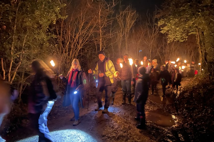 Torchlight procession leads revellers through Swan Barn orchards