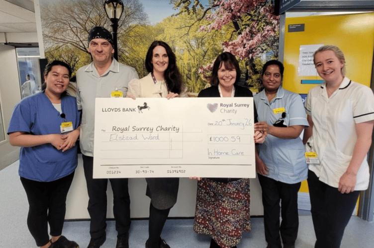 Director Claire Simmons presents a cheque for £1,000.59 to the Royal Surrey County Hospital’s Elstead Ward