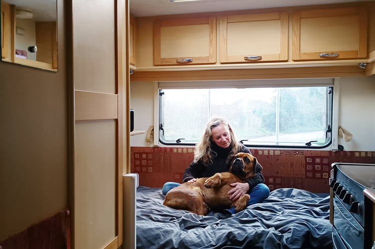 Sherry Smith with Remi in the motorhome. A gran is now rent and mortgage free, after using her divorce settlement to pay for a motorhome, which she lives in full time.  Sherry Smith, 62 decided to move into a motorhome after splitting from her husband, to save herself £900 a month on rent.   The cleaner, from Waterlooville, Hampshire, is now able to work less, and uses the extra cash to treat her grandchildren.  She parks up for free on her clients posh driveways, and is able to put away £400 a month, which she plans to use to travel around in her van. 
