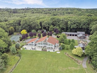 Sustainable woodland mansion with helipad hits market for £4m