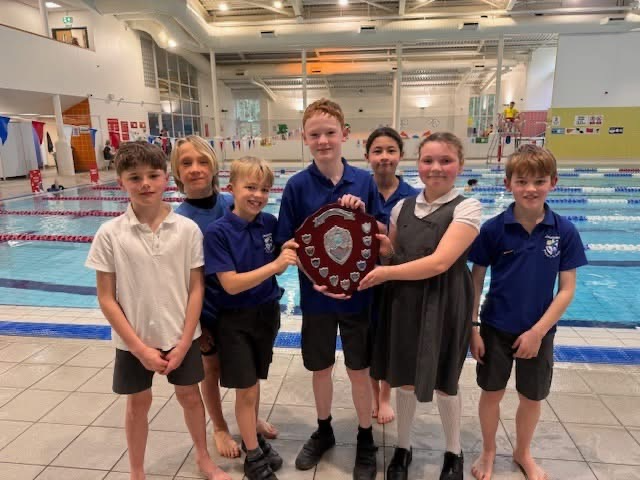 Yellow House celebrate victory after being crowned champions at Camelsdale School’s annual Swimming Gala at Haslemere Pool. Credit: Camelsdale School.