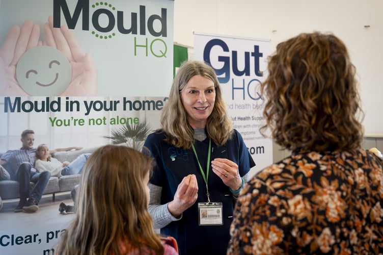 Health Network Hub founder Sarah Bicknell speaks with residents at the Churt wellbeing fair.