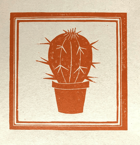 Print of a cactus in a pot.