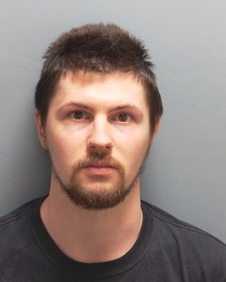 A Hampshire Police custody photo of Ethan Orchard, 30, who was jailed for sexual offences.