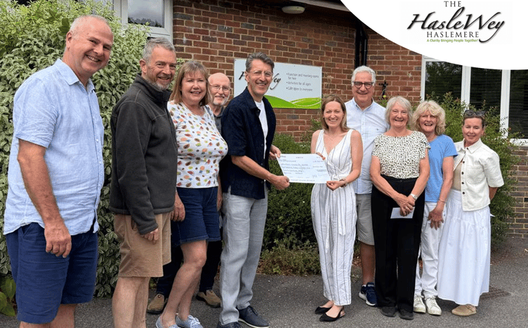 Little Lumpy organiser Jon Mills presents a cheque for £4,322.40 to the Haslewey Community Centre team following this year's successful cycling sportive.