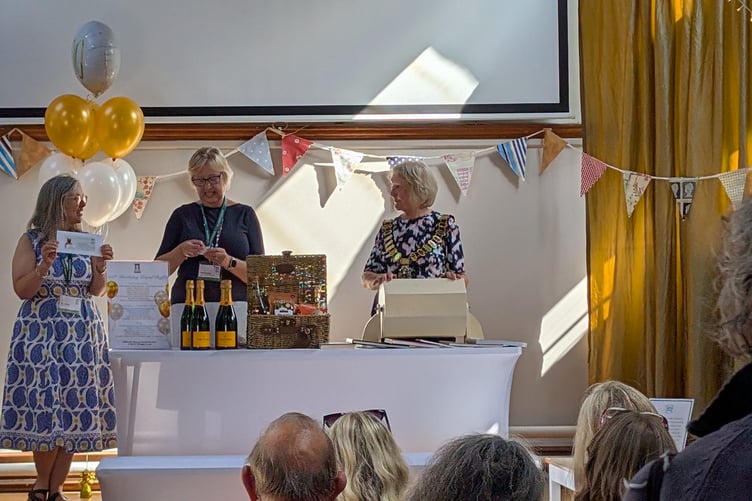 Haslemere Mayor Jacquie Keen draws the raffle at Haslemere Museum’s 100th birthday celebration.
