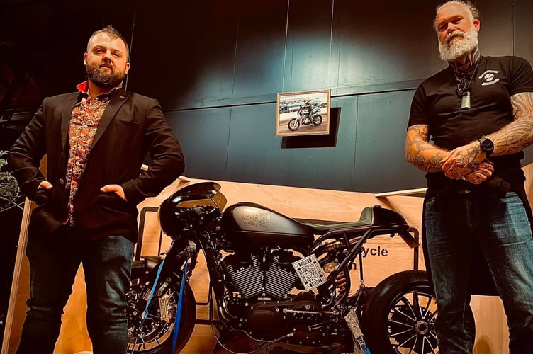 Dom Barker and Mason Haynes with one of their custom bikes.