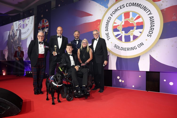 Animal Partnership Award In partnership with Pets at Home winner presented by Hounds for Heroes, presented by Richard Dening-Smitherman, Managing Director, Vet Business and Lieutenant General (Ret'd) Richard Nugee CB CVO CBE, Chairman X-Forces Enterprise and Debra Allcock-Tyler CEO, Directory of Social Change, Co-Chair Judges TAFCA.
2026 The Soldiering On Awards (SOA) at The Park Plaza Hotel, Westminister Bridge, London. The Armed Forces Community Awards honours individuals, veterans, service families, and allies through year-round recognition of resilience, innovation, and support.
The Soldiering On Awards (SOA) recognise the outstanding achievements of those who have served our country, the diverse people and groups who work together in support of the Armed Forces Community. We aim to encourage support for this remarkable community by celebrating the achievements of the people, teams, and businesses within it.
The Armed Forces Community Awards, a nationally recognised platform celebrating extraordinary contributions across the military sector, continues its expanded year-round mission to honour the individuals, veterans, service families, and allies shaping the future of the Armed Forces community.
Originally founded in 2011 as a tribute to military service, the Awards entered a transformative era in 2018 to better reflect the modern defence landscape. While proudly building on more than a decade of legacy and past recipients, the organisation has deepened its focus on today’s evolving stories of resilience, innovation, and community support.