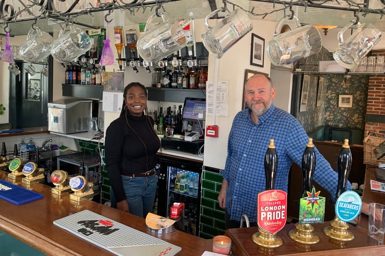 Martin Groves of The Hop Blossom in Farnham, with a staff member.